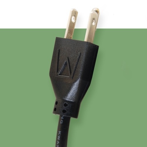 A black power cord on a green background.