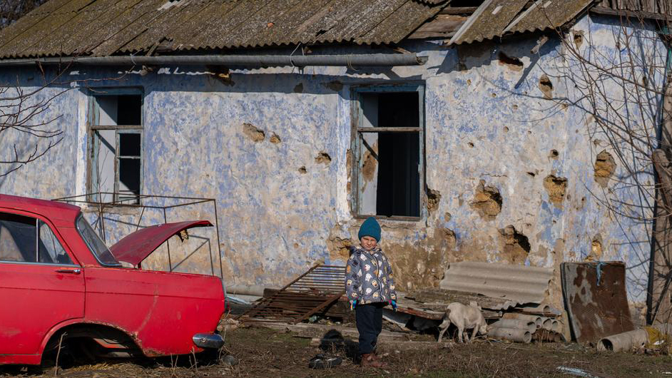 Roma, 4, stands in front of his destroyed home in Kobzartsi, Mykolaiv region Roma, 4, stands in front of his destroyed home in Kobzartsi, Mykolaiv region