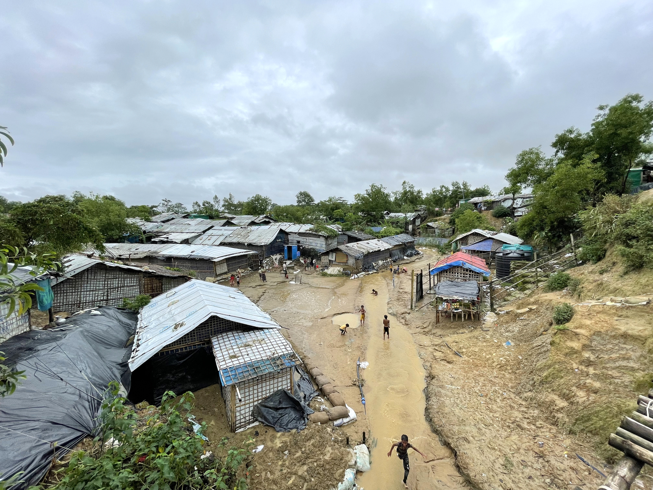 <p><sub>Rohingya refugee children play after the rain in Nayapara refugee camp in Teknaf, eastern Bangladesh. Heavy monsoon rains and strong winds caused flash floods and landslides in Rohingya refugee sites in Cox’s Bazar in July 2021.</sub></p> <p><sub>Rohingya refugee children play after the rain in Nayapara refugee camp in Teknaf, eastern Bangladesh. Heavy monsoon rains and strong winds caused flash floods and landslides in Rohingya refugee sites in Cox’s Bazar in July 2021.</sub></p>