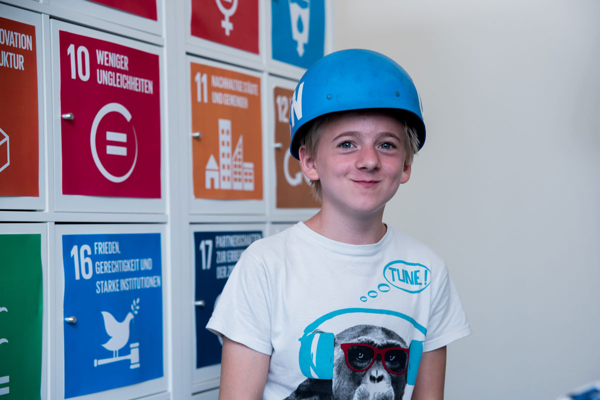 Guided tour participant wearing a ‘blue helmet’ Guided tour participant wearing a ‘blue helmet’